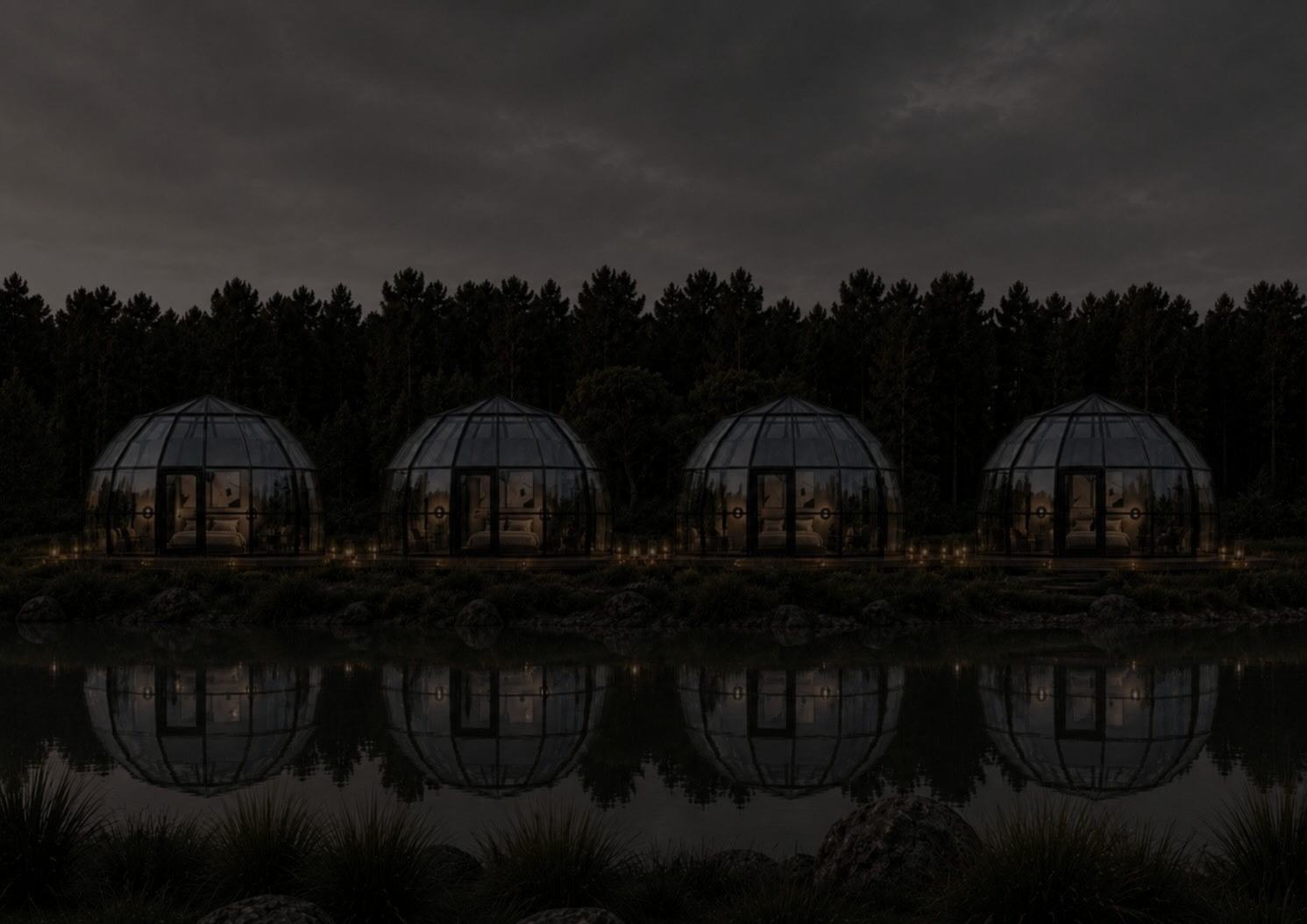 A row of domes over calm water at dusk