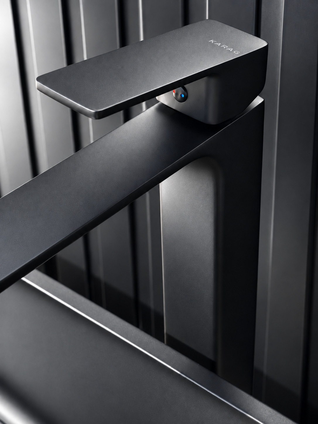 Detail: a matt-black basin mixer against the slatted wall